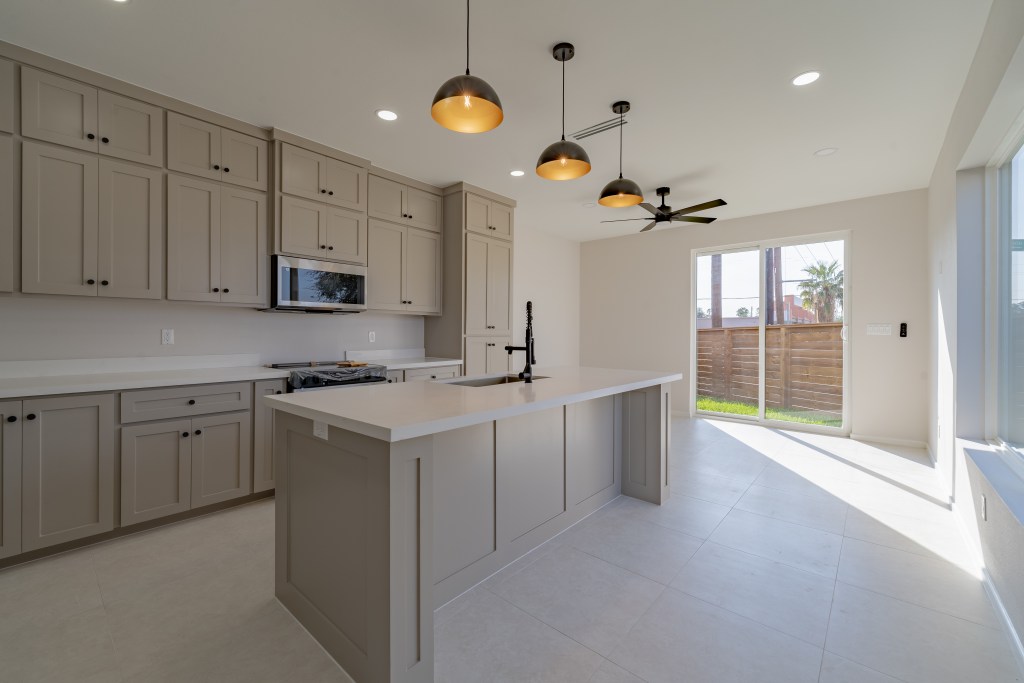 Open concept kitchen quartz countertops modern townhome McAllen