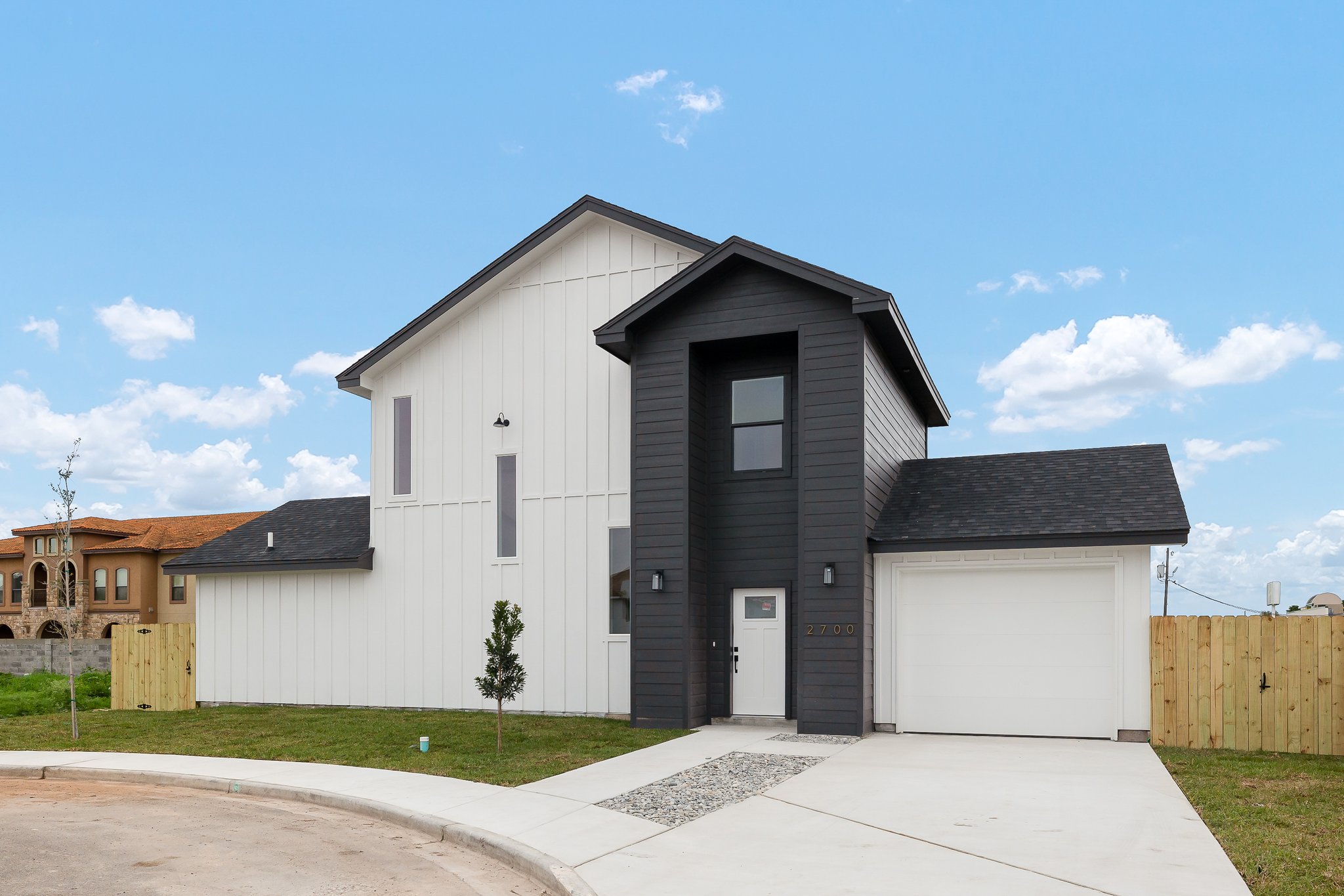 2700 Stablewood · front elevation with board and batten and black accent tower