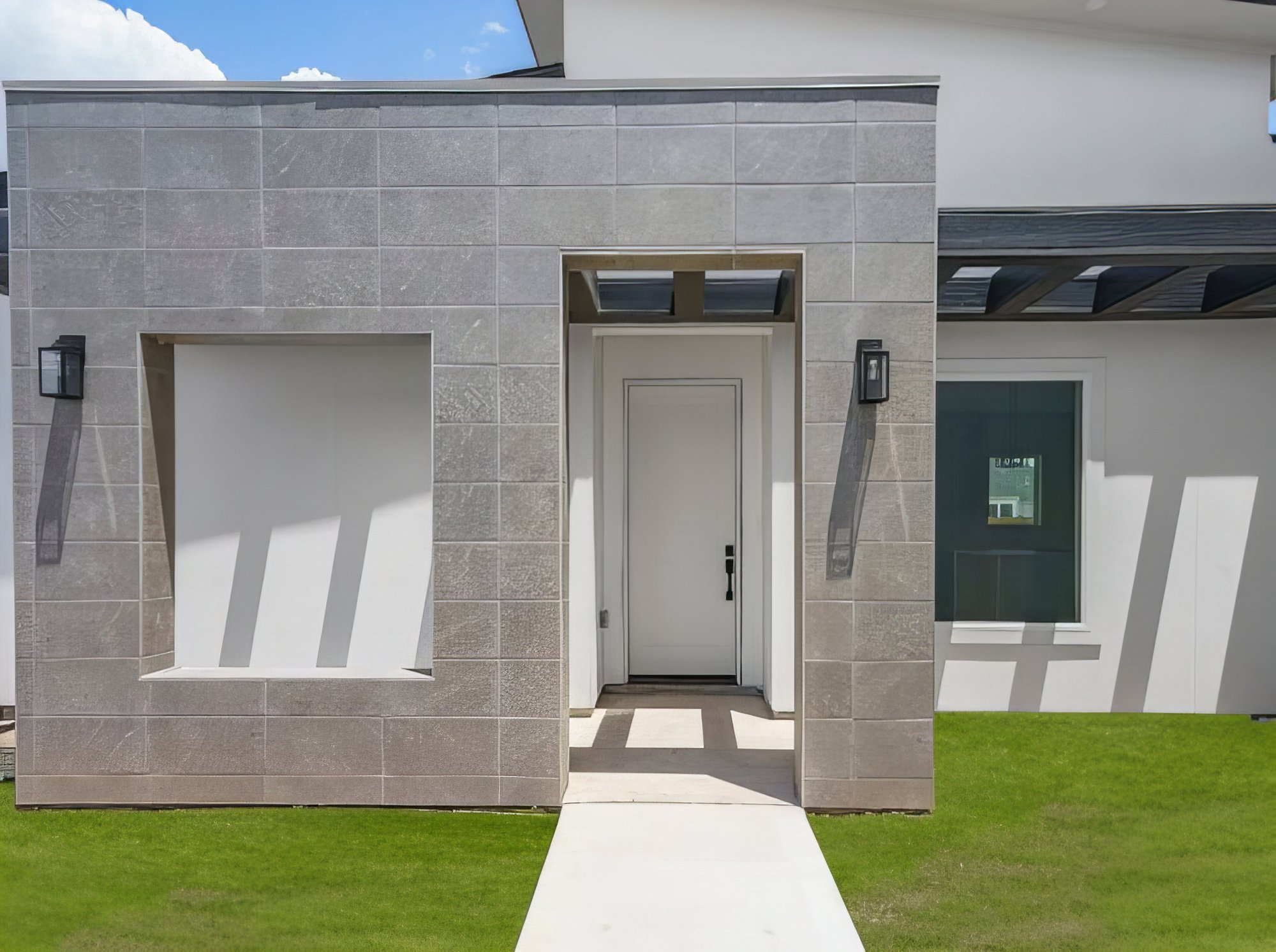 The Vincent · stone tile entry detail with recessed picture window