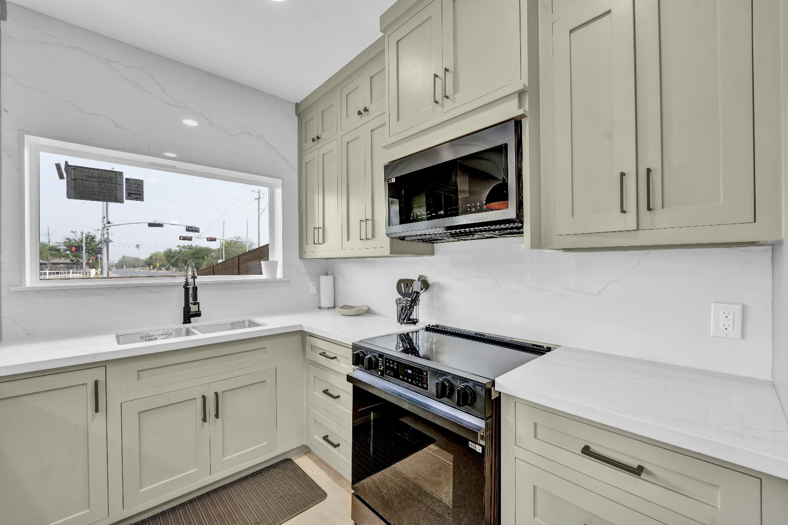 Bicentennial Townhouse · kitchen range and quartz backsplash detail