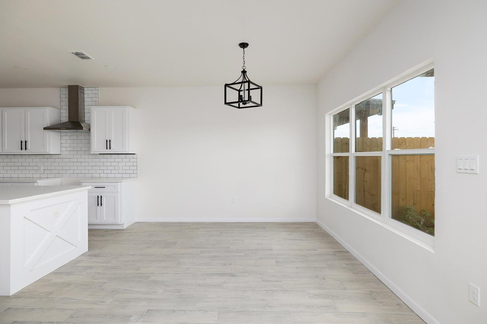 Cassandra Row · farmhouse dining with lantern pendant