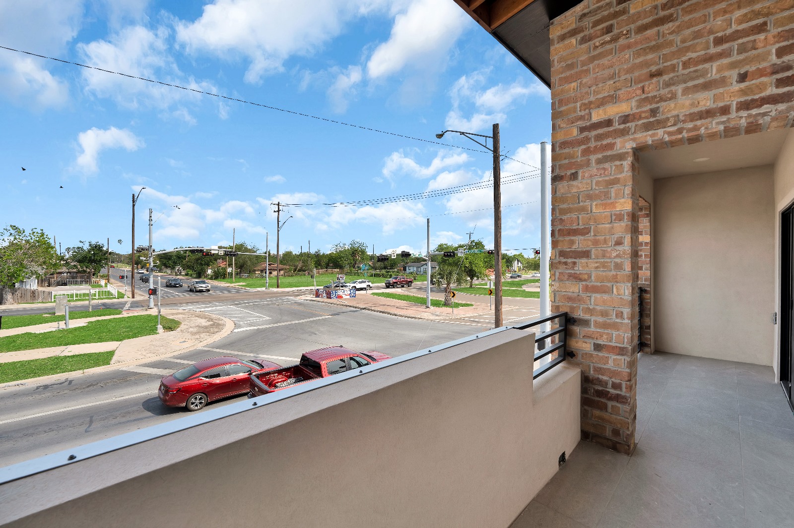Bicentennial Townhouse · upper balcony with brick wall and street view