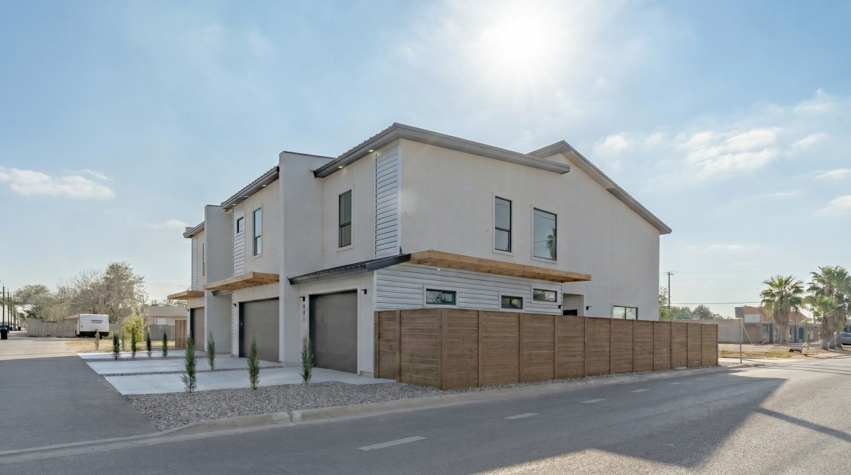 Street view of the modern townhomes Sisu Development built at 900 South Bicentennial in McAllen, TX